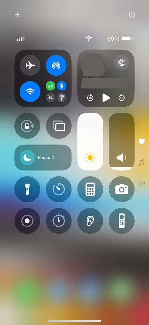 Open Control Center by swiping down from the top-right corner